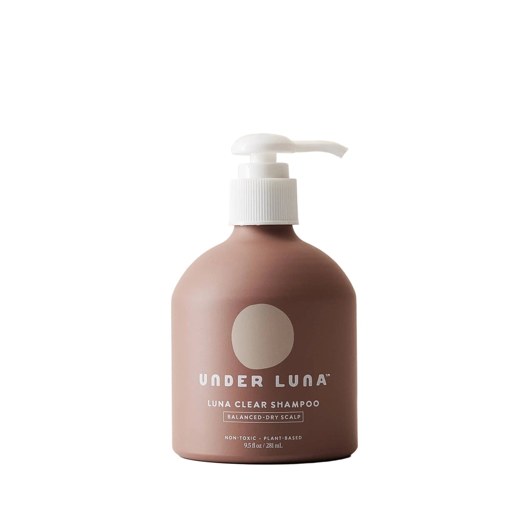 Brown shampoo bottle with pump labeled 'Under Luna' on a beige background. Shampoo free from essential oils and free from fragrance.
