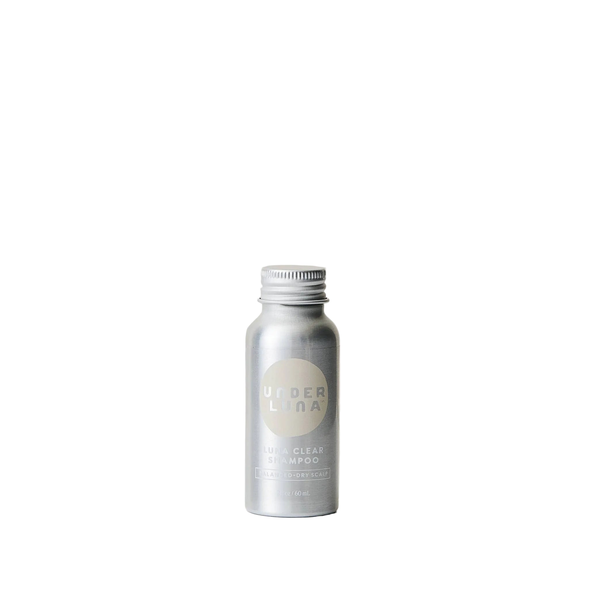 Silver shampoo bottle with 'Uner Lina' branding on a beige background. Essential oil Free and Fragrance Free natural shampoo